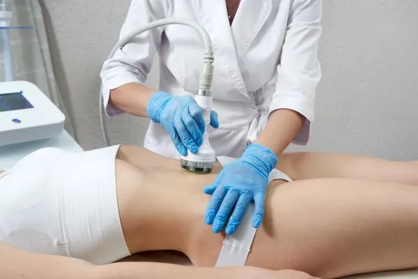 Lost the Weight but Not the Loose Skin? 2 woman having HIFU treatment on her stomach to combat loose skin Central Milton Keynes following weight loss
